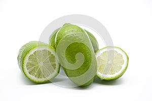 fresh whole and slice green Lemons isolated on white background