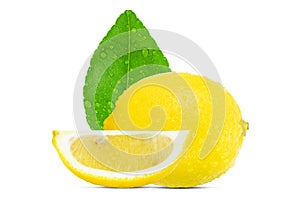Fresh whole and sliced lemon with leaf and water drops isolated on white background with clipping path