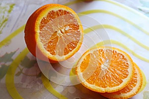 Fresh winter orange on the plate photo
