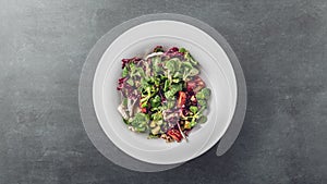 Fresh winter spring salad on a grey background