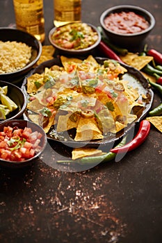 Fresh yellow corn nacho chips on ceramic plate