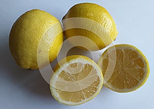 Fresh yellow lemon fruits, split in half
