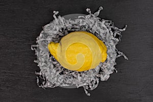 Fresh yellow lemon on grey stone