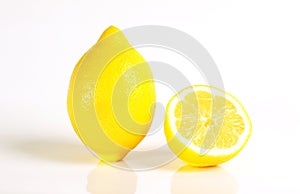 Fresh yellow lemon and a half