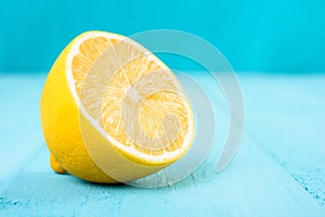 Fresh Yellow Lemon Slice On Turquoise Table