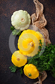 Fresh patissons on old rusty background