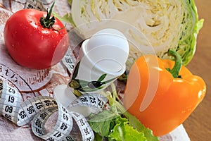 Pepper, egg, cabbage, tomato, salad and ruler on napkin