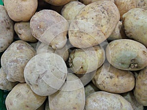 Fresh yellow potatoes in the market