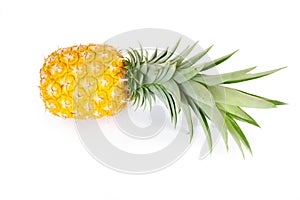 Fresh, yellow, ripe pineapple fruit with green leaves isolated on a white background. Healthy tropical fruit for smoothies and