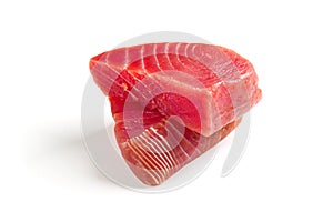 fresh yellowfin sliced tuna steak isolated on a white background. bluefin tuna medallions