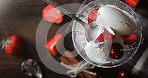 Fresh yogurt with berries. Ice cream in a bowl with fresh and juicy strawberries and cherries. Dessert with red berries