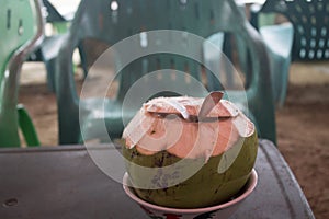 fresh young coconut that has been peeled and ready to serve. Young coconut water has many benefits to replace body ions