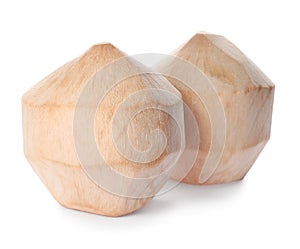 Fresh young peeled coconuts on white background