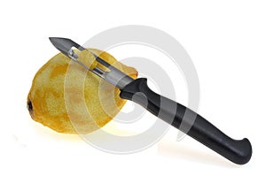 Fresh zested lemon with kitchen utensil