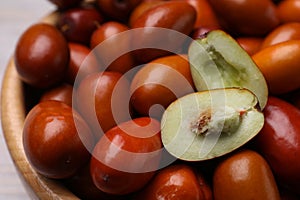 Fresh Ziziphus jujuba fruits in bowl, closeup