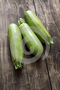 Fresh zucchin on a old wooden board