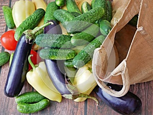 fresh zucchini, cucmber, tomato, lettuce and vegetables on gray background, healthy food