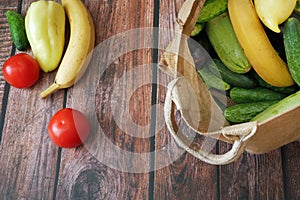 Fresh zucchini, cucmber, tomato, lettuce and vegetables on gray background, healthy food