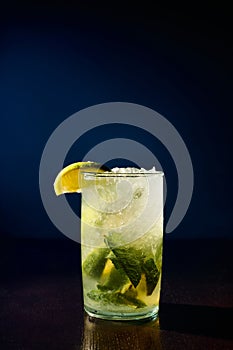 freshening glass of mojito garnished with