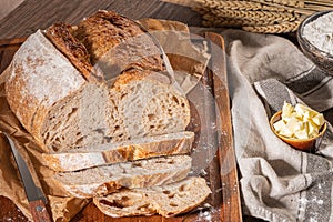 Freshly artisan baked wheat and rye bread, country bread. Simple bread  with butter for breackfast