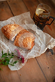 Freshly baked appetizing bun and tea