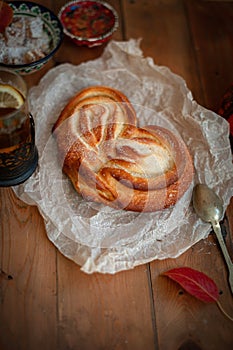 Freshly baked appetizing bun and tea