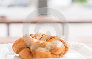 Freshly baked bagel on a plate in the morning