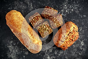 Freshly baked bloomer, ciabatta bread and sandwich buns