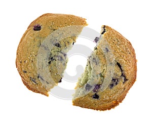 Freshly baked blueberry muffin top broken in half