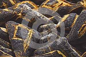 freshly baked bread and baked goods in a basket on the counter of the bakery.