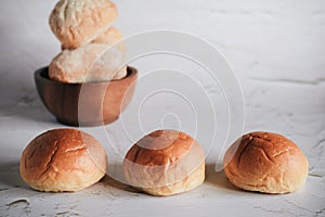 Freshly baked bread. Organic whole-wheat loaves on white background.