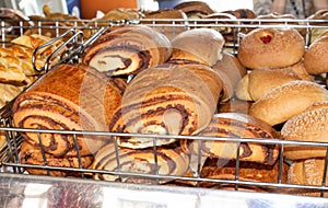 Freshly baked bread, shelves with sweet buns in the window. Confectionery. Quito, Ecuador