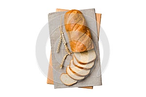 Freshly baked bread slices on cutting board isolated on white background . top view Sliced bread