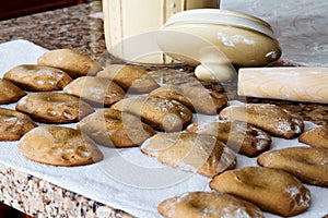 Freshly baked brown jam filled molasses cookies;