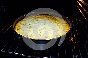 Freshly baked cheesecake in the oven.