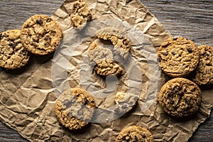 freshly baked Chocolate chip cookies on a wooden table with place for text