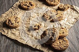 Freshly baked Chocolate chip cookies on a wooden table with place for text