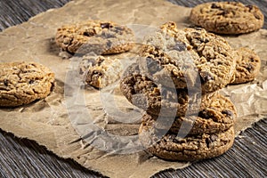 freshly baked Chocolate chip cookies on a wooden table with place for text