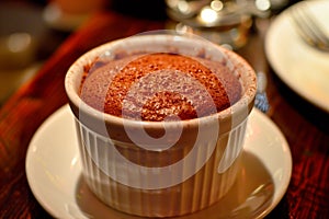 A freshly baked chocolate lava cake with a molten center. Chocolate cake or fondant powdered sugar on top