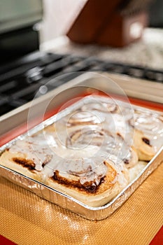 Freshly Baked Cinnamon Rolls Cooling on Stove Top