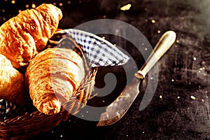 Freshly Baked Croissant and Cutting Knife on Table