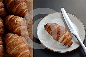 The freshly baked croissants on black background. Flat style