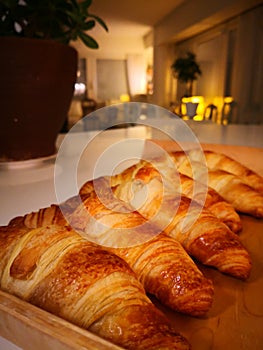 Freshly baked croissants on the table, a photo taken with a smartphone