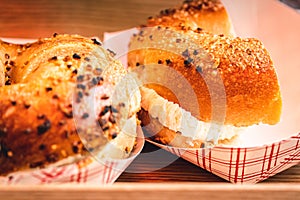Freshly baked, crunchy typical NYC bagels with sesame, poppyseed topping, cream cheese spread and lox from coffee shop