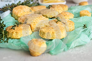 Freshly baked delicious english scones or cookies with cheese and thyme.