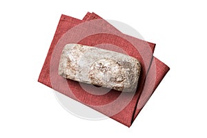 Freshly baked delicious french bread with napkin isolated on white background top view. Healthy white bread loaf