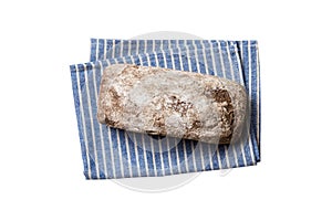 Freshly baked delicious french bread with napkin isolated on white background top view. Healthy white bread loaf