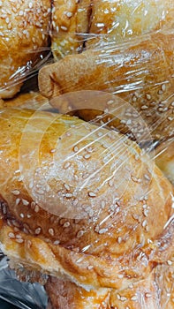 Freshly baked delicious golden brown meat pies sprinkled with sesame seeds