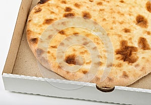 Freshly baked flatbread in delivery box