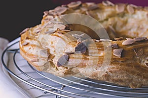 Freshly baked french dessert profiterole cake covered with roast